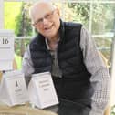 Keith Horncastle with next year's Memory Calendar and some of the early prototypes he and his late wife used to develop the idea
