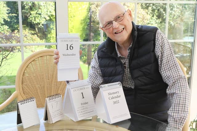 Keith Horncastle with next year's Memory Calendar and some of the early prototypes he and his late wife used to develop the idea