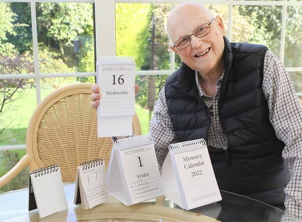 Keith Horncastle with next year's Memory Calendar and some of the early prototypes he and his late wife used to develop the idea