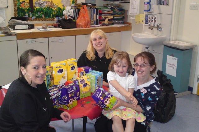 Eileen Eccles and Teresa Beresford, from Rayner and Ridgewell Opticians deliver the donated Easter Eggs to Stepping Hill Hospital in 2011. Photo contributed.
