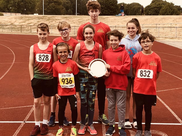 Members of High Peak Athletics club celebrate success.