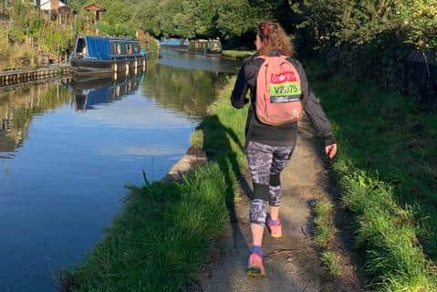 Liz Land walked the 26.2 miles of her marathon along the canal from New Mills to Bollington and back.