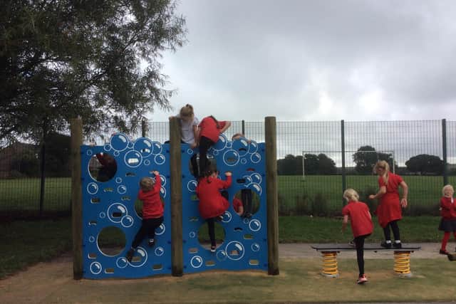 Children at Fairfield Infant and Nursery School playing on the new equipment they raised funds for. Pic submitted