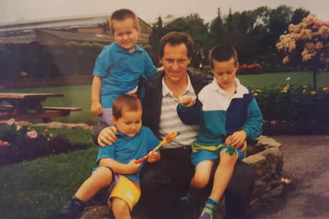Young Oliver Sykes and two of his brothers with dad Chris