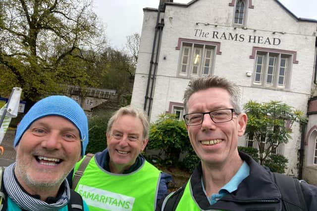 Ian, middle, with colleagues, walking for Samaritans in Disley - en-route to Buxton in November last year
