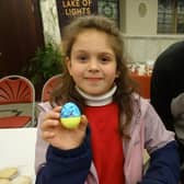 Milanka Klimenko holding up the decoration she has made with FoBS member Will Blake.