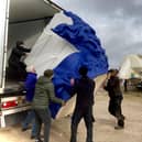 Giant blue head is carefully offloaded from its container.