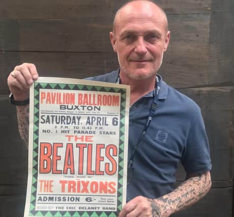 Karl Martin, valuer at Hansons, with The Beatles poster advertising their gig in Buxton.