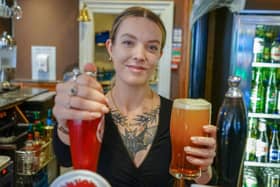Olivia serving behind the bar at The Wye Bridge House. Photo Brian Eyre