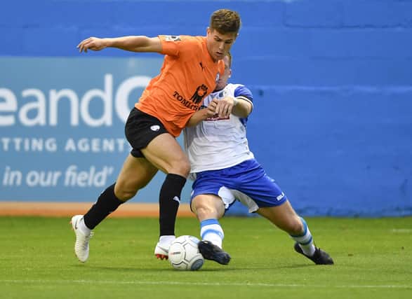 New Buxton defender Josh Granite in action for Barrow against Chesterfield.