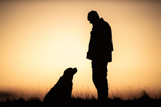 VILLAGER JIM AND HIS LOYAL LABRADOR