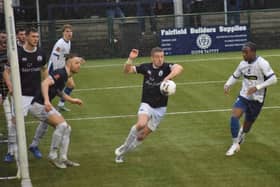 Josh Granite (centre) tries to clear as Banbury threaten on Saturday. Photo: BUFC.