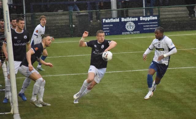 Josh Granite (centre) tries to clear as Banbury threaten on Saturday. Photo: BUFC.