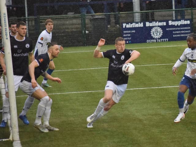 Josh Granite (centre) tries to clear as Banbury threaten on Saturday. Photo: BUFC.