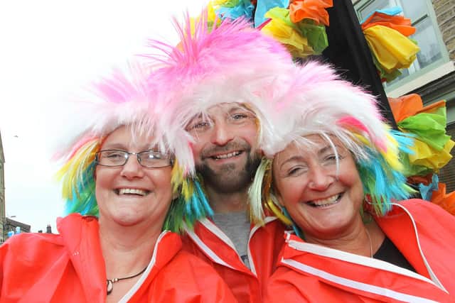 New Mills Festival's  volunteers Lyn Bannister, Martin Burton and Sharon Burgess showing their silly side at New Mills Carnival