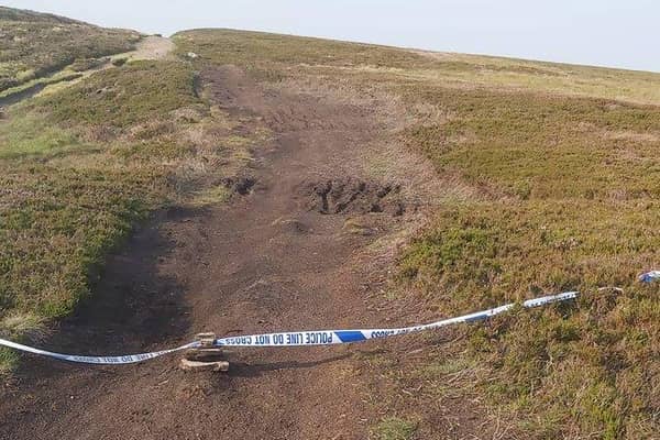 Police and bomb disposal experts were called after a shell was found in the Peak District (pic: Woodhead Mountain Rescue Team)