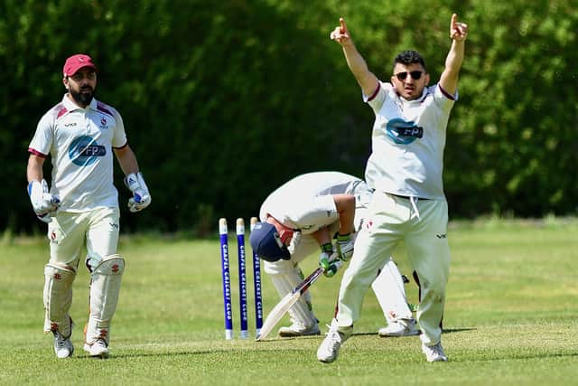 Hollingworth's Sani Saleem on his way to 6-17 as he bowls Chapel's Joe Berry for three. Pic by John Fryer.