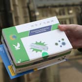 Large boxes of Covid tests being handed out at the Pavilion Gardens, Buxton, on December 23.