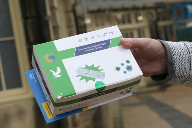Large boxes of Covid tests being handed out at the Pavilion Gardens, Buxton, on December 23.