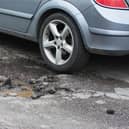 Derbyshire is receiving “peanuts” in road repairs funding compared to London, leaving it to make “sticking plaster” repairs, an MP and council leader have said.