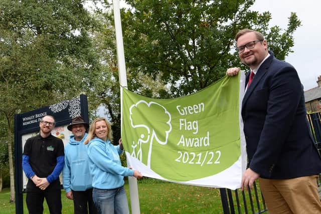 Councillor Damien Greenhalgh, right, joined members of the Friends of the Memorial Park and Trefer Jones from AES in the park last year to celebrate the park being awarded a Green Flag in 2021 for the seventh successive year.