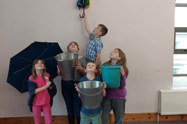 Young members of the church inspect the damage.