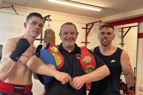 A very proud owner and trainer Ian Nolan with his champion ship fighters Liam Burke and Johnny Lowe