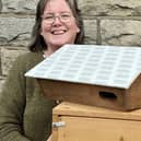 Deb Pitman with some swift boxes ready to be installed.