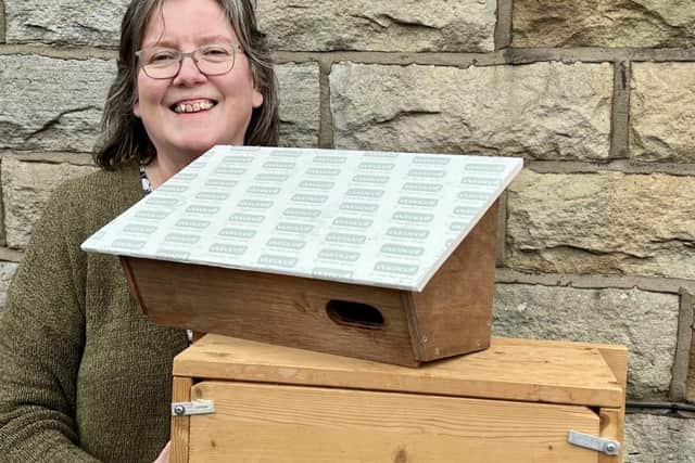 Deb Pitman with some swift boxes ready to be installed.