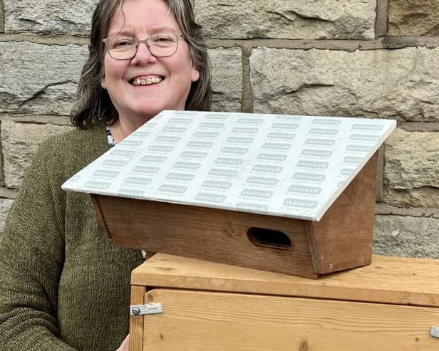 Deb Pitman with some swift boxes ready to be installed.