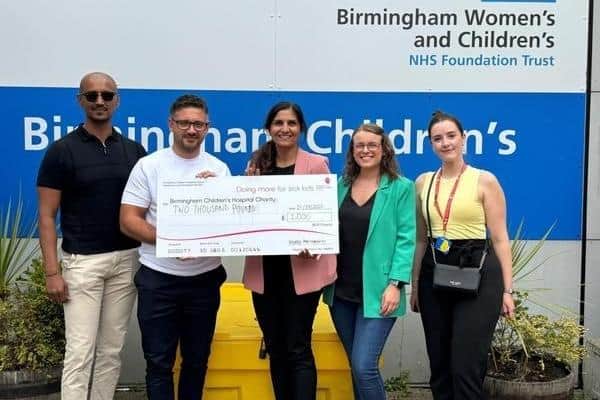 Morro Partnerships present Birmingham Children's Hospital with a cheque for £2,000