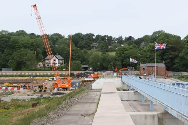Toddbrook Reservoir, the top of the dam will eventually be level removing the need for the metal walkway.Pic Jason Chadwick