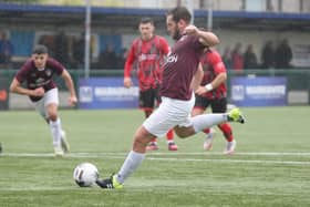 Jak McCourt tucks away a penalty for Buxton against Mickleover.