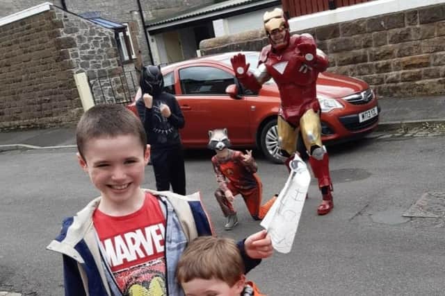 Eddie and Noah Lowton, foreground with Ironman, Black Panther and Rocket Raccoon