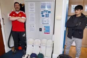 Some of the cricket kit with one of the very happy young lads who reside with Adullam Homes