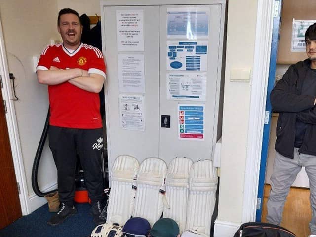 Some of the cricket kit with one of the very happy young lads who reside with Adullam Homes