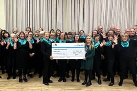 Buxton Community Choir hands over cheque to Blythe House Hospicecare and Helen's Trust