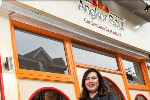 Y Sok outside her Marple restaurant