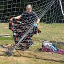 Scared fox gets trapped in goal netting...watch how he gets rescued