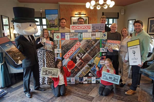 The launch event at The George in Hathersage. Mr Monopoly with the new board game and local businesses in the new game.