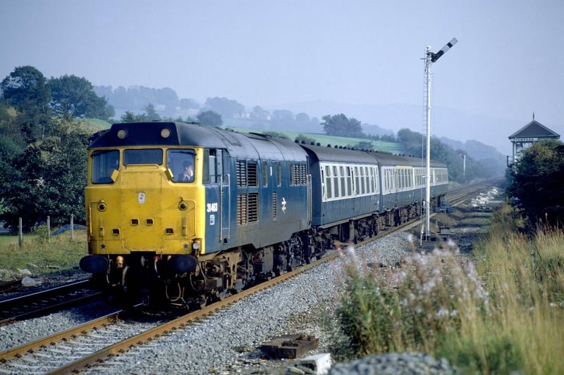 Bamford Station, Hope Valley. No. 31.463 rushes through Bamford Station with the 12.45 ex Cleethorpes for Manchester, 1985. (Photo by Rail Photo/Construction Photography/Avalon/Getty Images)