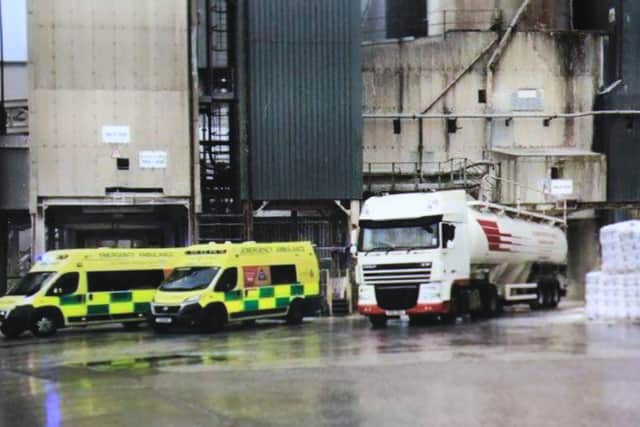Paramedics surround Kev's lorry at the scene of the accident
