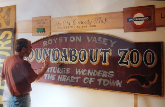 David Hill hard at work on one of the signs
