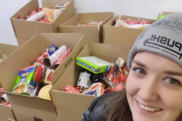 Ruth Eyre-Barnes with the donations to start making up the Christmas hampers for families in need. Photo Ruth Eyre-Barnes
