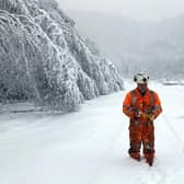 A Network Rail worker in snow up to eight inches above the railhead at Grindleford.