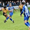 Olaolu Odipe clears for New Mills on Saturday. Photo by John Fryer.