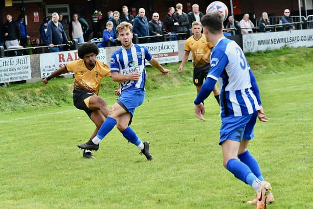 Olaolu Odipe clears for New Mills on Saturday. Photo by John Fryer.