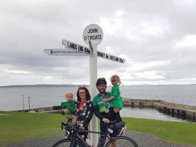 Mikey Heathcote with his wife Leanne and their children at the finishing line