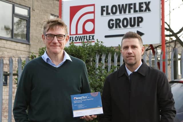 Flowflex Group managers Richard Wilcock and Craig Chesney with a Covid test kit produced by another company of the same name. 