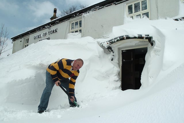 Keith Jackson landlord of the Duke of York at Pomeroy south of Buxton digging out after four days without a customer. The snow reached above the bedroom window sills!. Photo Jason Chadwick